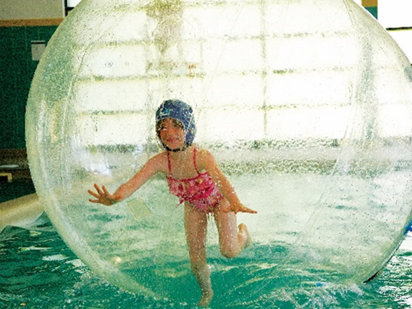 Girl in inflatable ball
